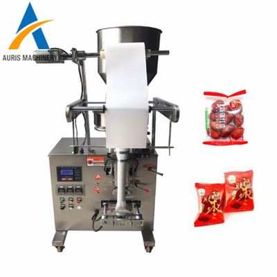 Granello automatico che pesa i fagioli della macchina imballatrice del cioccolato che sigillano macchina