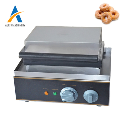 Il creatore commerciale della ciambella della placca a pressione lavora le ciambelle a macchina multiple automatiche